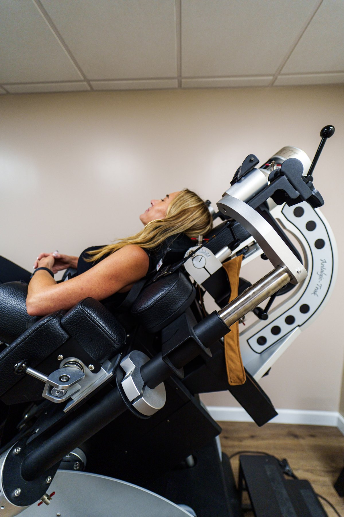 Patient on the Antalgic-Trac spinal decompression table at Car Accident Doctors Group in Lighthouse Point, FL